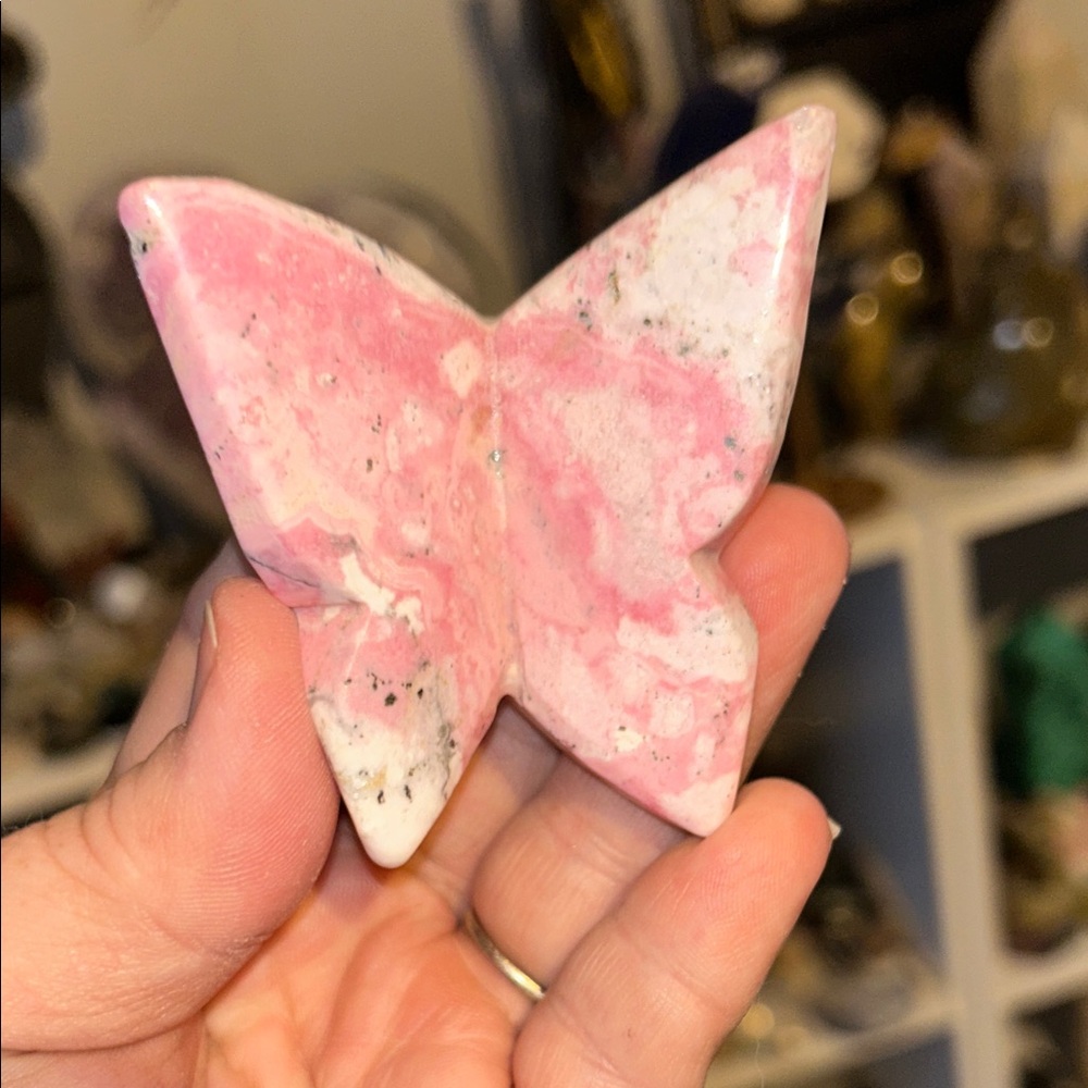carved butterfly figure made from rhodochrosite crystal.